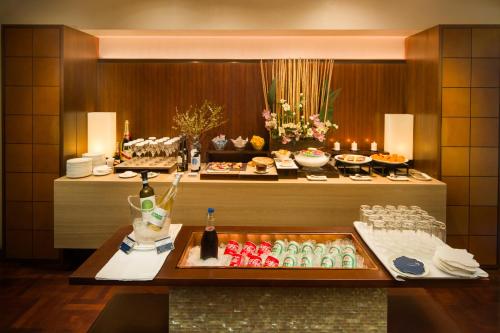 a buffet in a hotel room with food and drinks at les suites taipei ching cheng in Taipei