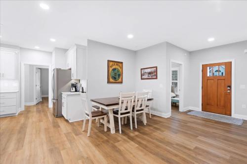 a kitchen and dining room with a table and chairs at 116 Pine Forest Drive in Ocean Pines