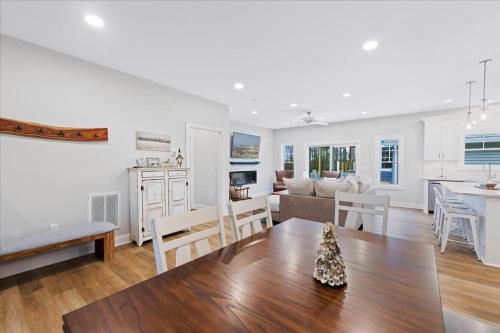 a kitchen and living room with a table and a couch at 116 Pine Forest Drive in Ocean Pines
