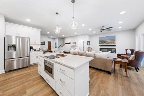 a kitchen and living room with white cabinets at 116 Pine Forest Drive in Ocean Pines