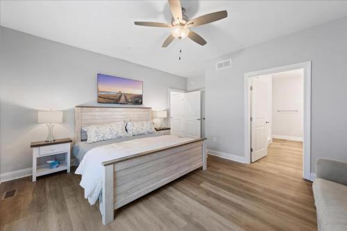 a bedroom with a bed and a ceiling fan at 116 Pine Forest Drive in Ocean Pines
