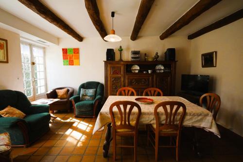 a living room with a table and chairs at Maison du GR34 Baie de Beaussais Classée 1 étoile in Beaussais sur Mer