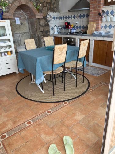 a blue table and chairs in a kitchen at Villa Fiorella in Sperlonga