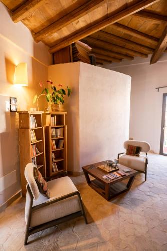 a living room with a couch and a table at Villa Amoroso - Ospitalità Mediterranea in Agrigento
