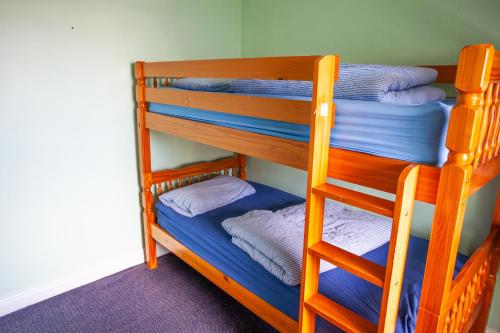 a couple of bunk beds in a room at Breakwater Hostel in Newquay
