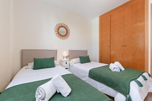 Postel nebo postele na pokoji v ubytování Seaview Golf Doña Julia