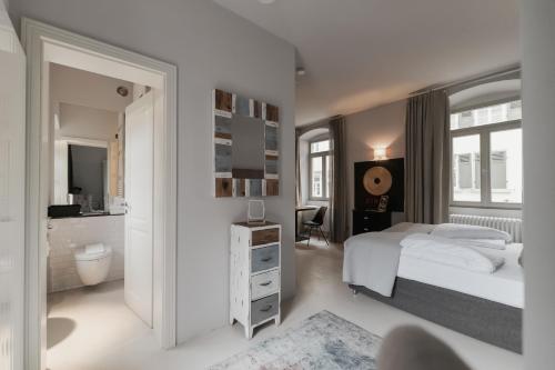 Ένα ή περισσότερα κρεβάτια σε δωμάτιο στο BS Suites