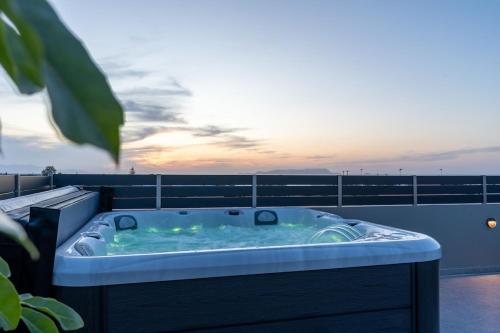a hot tub on the roof of a building at MD Horizon with private Jacuzzi near the beach in Anissaras