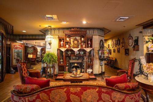 a living room with a couch and a fireplace at Boardwalk Plaza Hotel in Rehoboth Beach