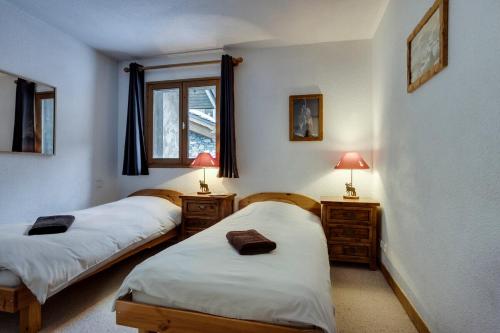 Ένα ή περισσότερα κρεβάτια σε δωμάτιο στο Chalet La Mourra