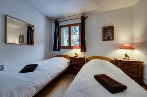 Ένα ή περισσότερα κρεβάτια σε δωμάτιο στο Chalet La Mourra