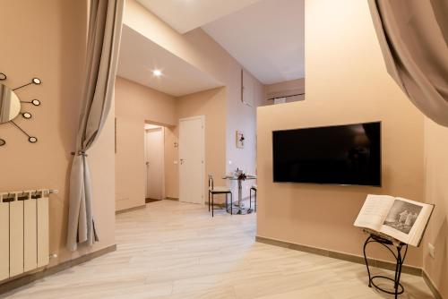 TV a/nebo společenská místnost v ubytování Dante Experience Apartment