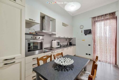 a kitchen with a table with a bowl on it at New Murlo, Terre Marine in La Spezia