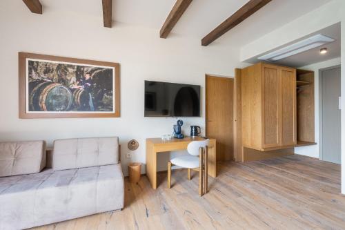 a living room with a couch and a table at Hiša Marija House in Miklavž pri Ormožu