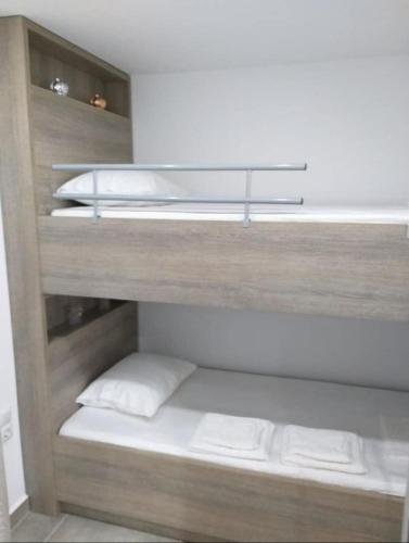 a bunk bed with two pillows in a room at Villa Morena in Mursi