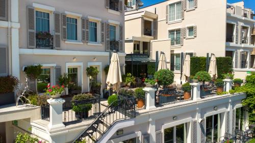 an apartment building with a balcony with umbrellas at Mula Hotel in Istanbul