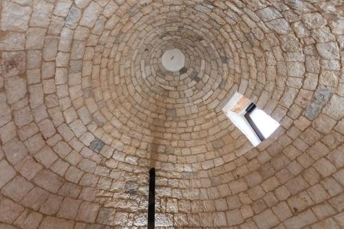 an overhead view of a wooden spiralukongasteryasteryasteryasteryasteryasteryasteryastery at Trullo Franza - Salento Reservation in Torre Suda