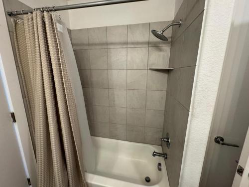 a bathroom with a shower with a shower curtain at cozy apartment in Leander in Leander