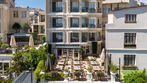 an aerial view of a hotel with tables and umbrellas at Mula Hotel in Istanbul