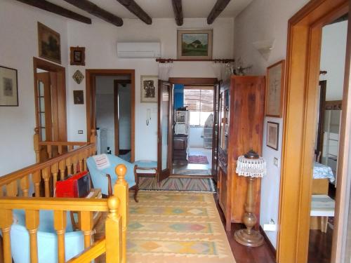 a living room with a stairway and a room with at L'Onda in Oristano