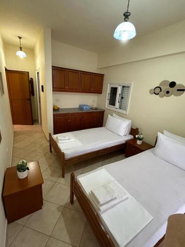 Postel nebo postele na pokoji v ubytování Nevi Rooms