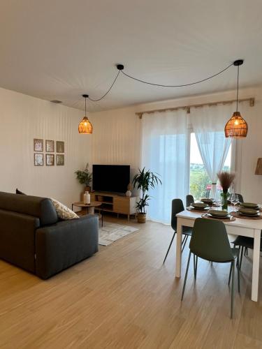 a living room with a couch and a table at Villa Anthea - Relax vista mare tra Palermo e Cefalù in Trabia
