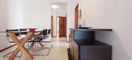 a dining room with a table and some chairs at Casa da Praia - Family and Friends, Surf and Beach in Vila Praia de Âncora