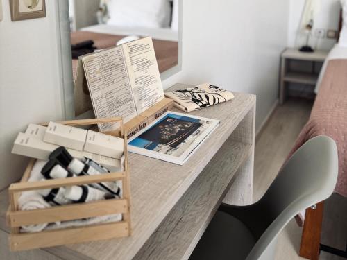 a desk in a bedroom with a table with a chair at Orama Milos in Adamas