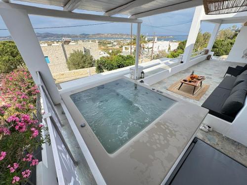 a house with a swimming pool on a patio at La vie est belle luxury apartment BBQ jacuzzi&view in Pounda