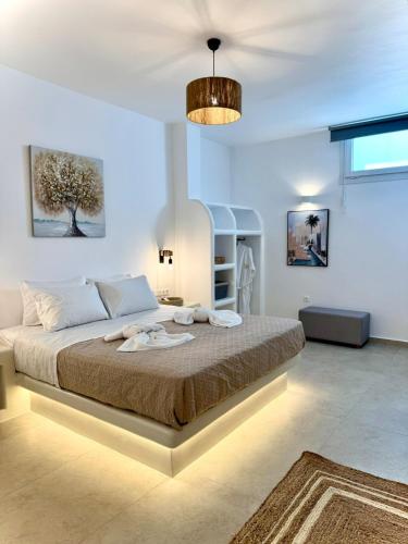 a bedroom with a large bed in a room at La vie est belle luxury apartment BBQ jacuzzi&view in Pounda