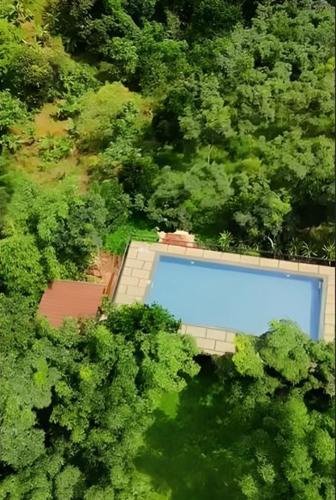 an overhead view of a building in the middle of a forest at Kap Korome Village Resort in Koroth