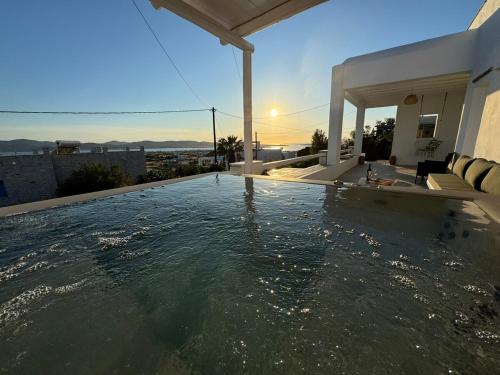 a swimming pool on the roof of a house at La vie est belle luxury apartment BBQ jacuzzi&view in Pounda