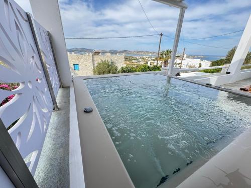 a swimming pool on the balcony of a house at La vie est belle luxury apartment BBQ jacuzzi&view in Pounda