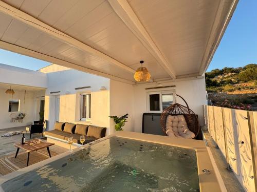 a house with a swimming pool on a patio at La vie est belle luxury apartment BBQ jacuzzi&view in Pounda