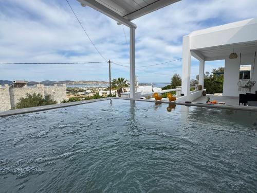 a swimming pool in the backyard of a house at La vie est belle luxury apartment BBQ jacuzzi&view in Pounda