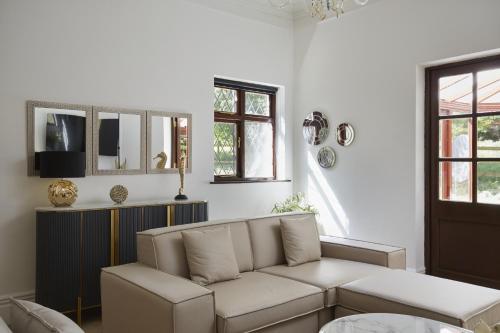 a living room with a couch and a table at Hayy Luxury Retreat At The Lodge in Bradford