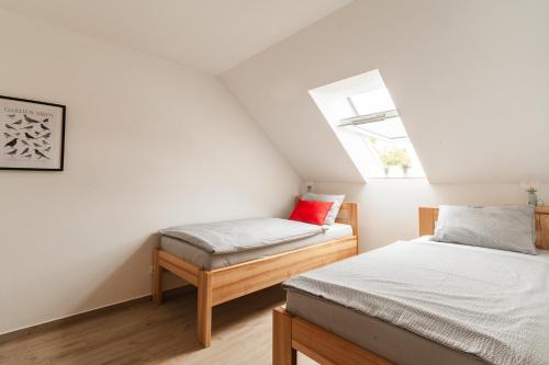 Postel nebo postele na pokoji v ubytování Stavení V Zahradě