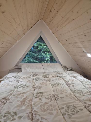 Ένα ή περισσότερα κρεβάτια σε δωμάτιο στο Kuća za odmor Carpe Diem