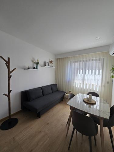a living room with a couch and a table at Vivenda Branca Martinho I in Peso da Régua