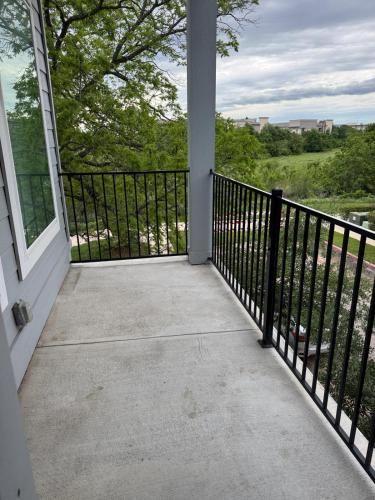 a balcony with a black fence and a view at Leander Gem Near Austin in Leander
