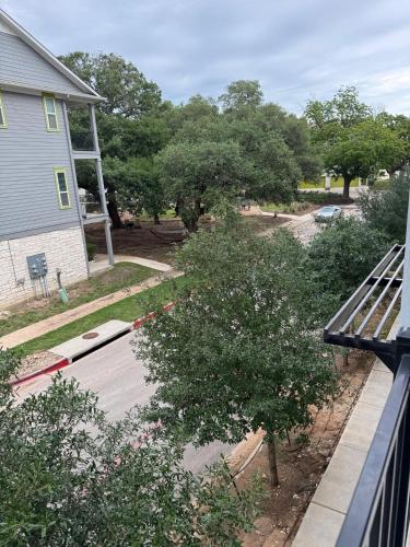 a view of a yard with trees and a house at Leander Gem Near Austin in Leander