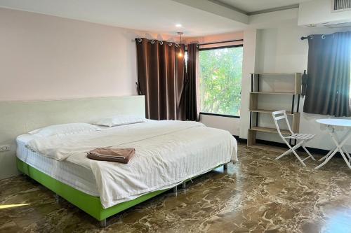 Postel nebo postele na pokoji v ubytování BKL Pool Villa Pattaya