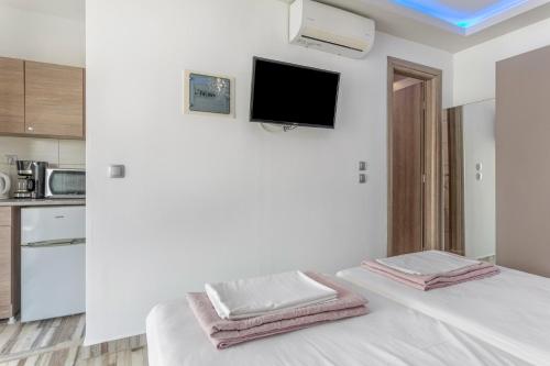 Ένα ή περισσότερα κρεβάτια σε δωμάτιο στο Villa Dionysia Studio S2