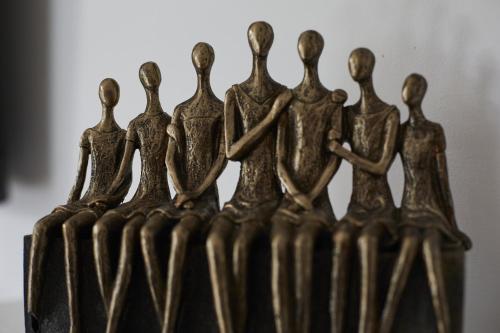 a bronze group of people standing in a row at Hayy Luxury Retreat At The Lodge in Bradford