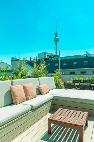 a bench sitting on top of a roof at Monbijou Hotel in Berlin