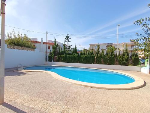 a small blue swimming pool in a yard at AyF ESPECTACULARES VISTAS DE MORRO DE GOS in Oropesa del Mar