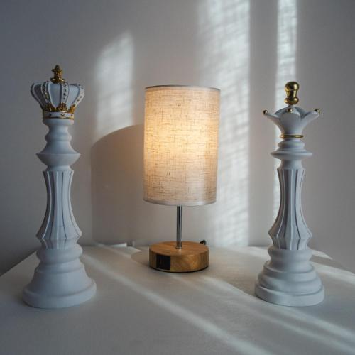 two white lamps sitting on a table next to a lampodox at The Regin in Civitavecchia