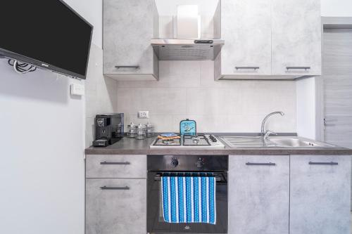 Kuchyň nebo kuchyňský kout v ubytování Le Quattro Perle Apartments