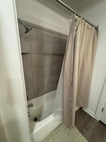 a bathroom with a shower with a shower curtain at Leander Getaway Near Austin in Leander