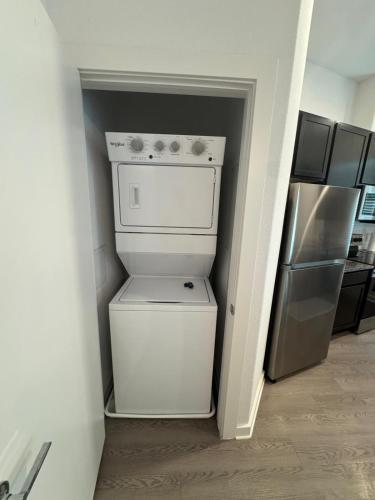 a white washer and dryer in a kitchen at Leander Getaway Near Austin in Leander